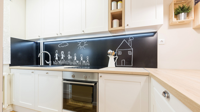 kitchen with a chalkboard backsplash