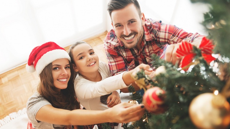 Man woman and child smiling