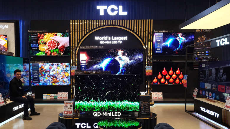 A TCL display in a store with multiple televisions