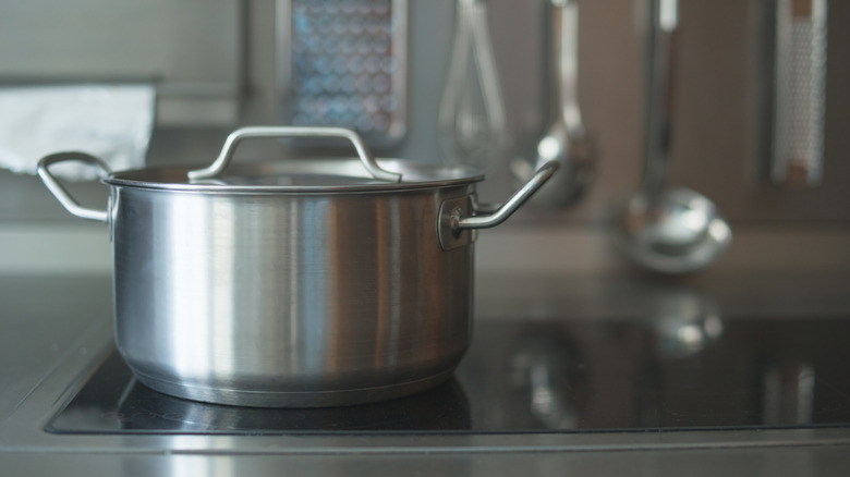 stainless steel pot on glass cooktop