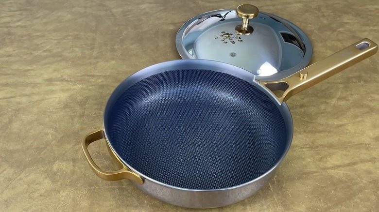 titanium coated pan with lid on countertop