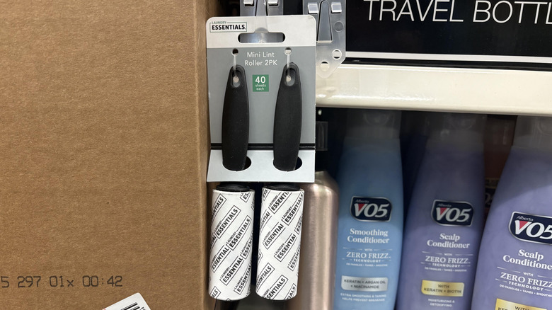 Pair of Dollar Tree lint rollers hanging on shelf