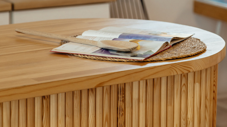 Bamboo countertop with book and spoon