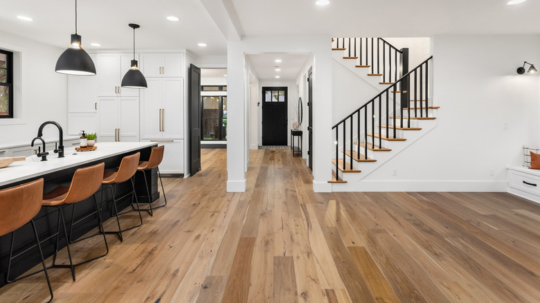 A modern kitchen with engineered wood flooring