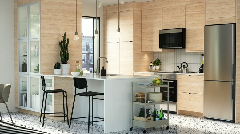 IKEA ASKERSUND light wood cabinets with white countertops