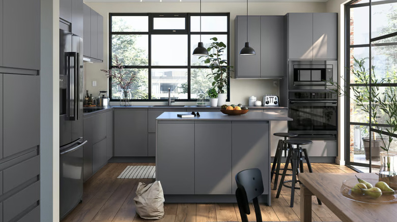 IKEA VOXTORP kitchen with dark gray cabinets and black decor