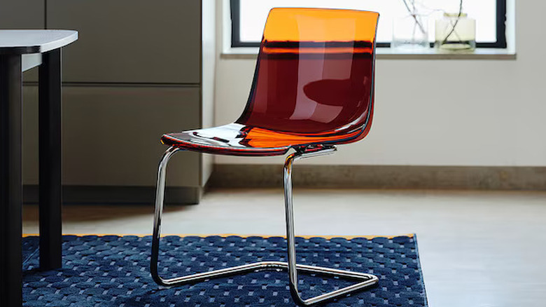 A reddish TOBIAS chair from IKEA