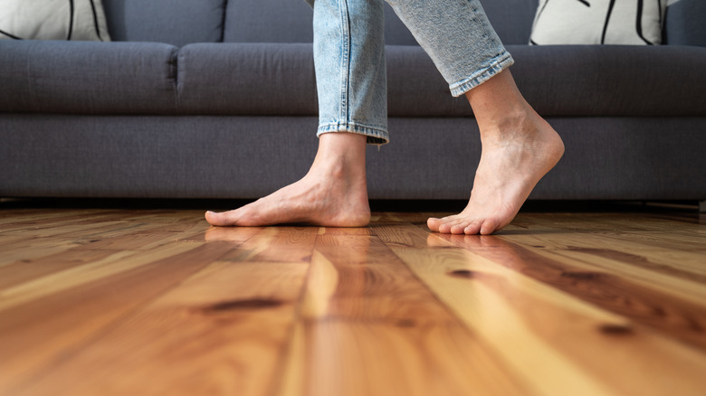 Bare feet on hardwood floor