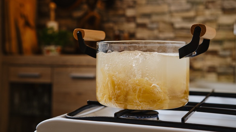 Clear pot with boiling water and pasta