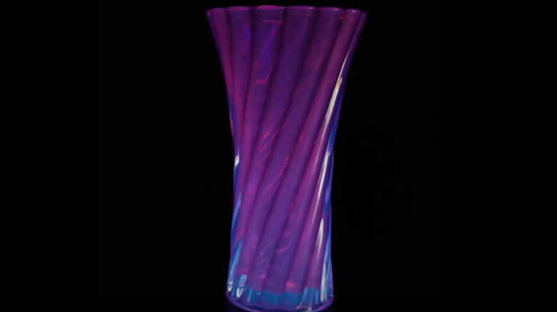 Lead crystal glass glowing purple under the UV light