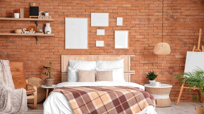bedroom with brick wall