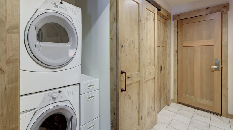 laundry room with farmhouse doors