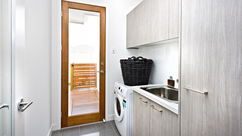 laundry room with glass door