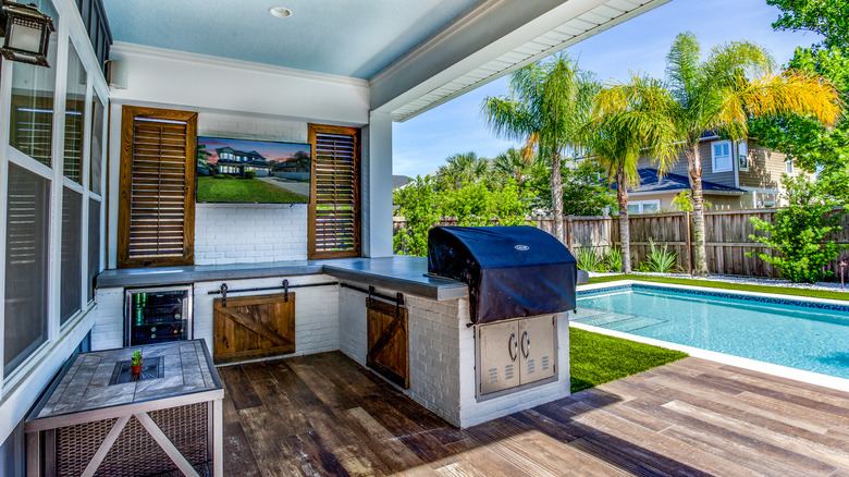 Outdoor kitchen with pool view