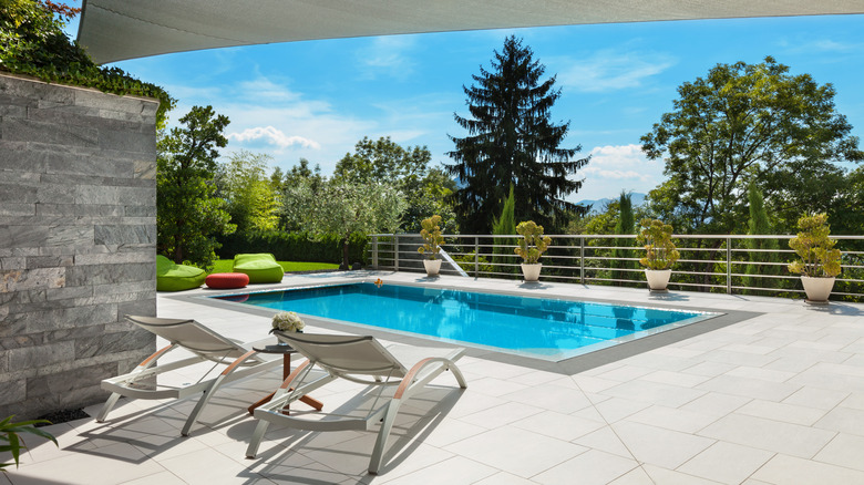 covered patio beside a pool