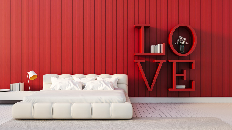 red bedroom with LOVE bookcase