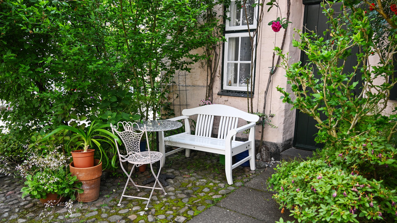 A small garden in front of an old house.