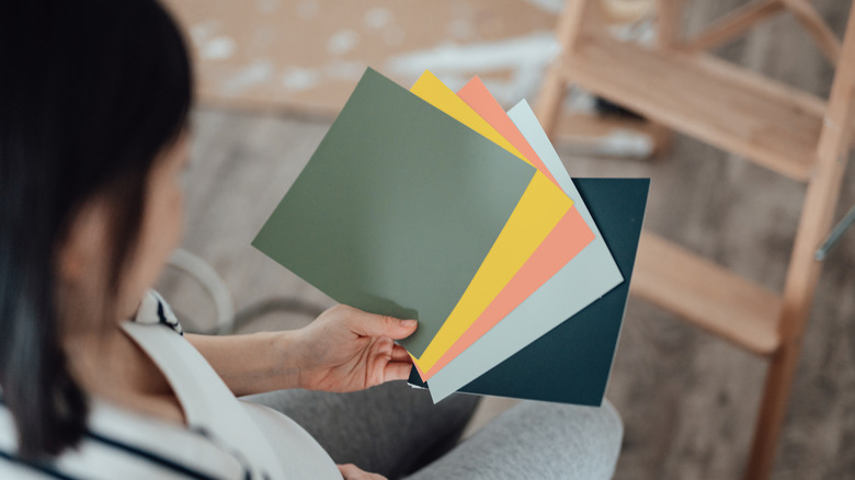 Woman looking at paint chips