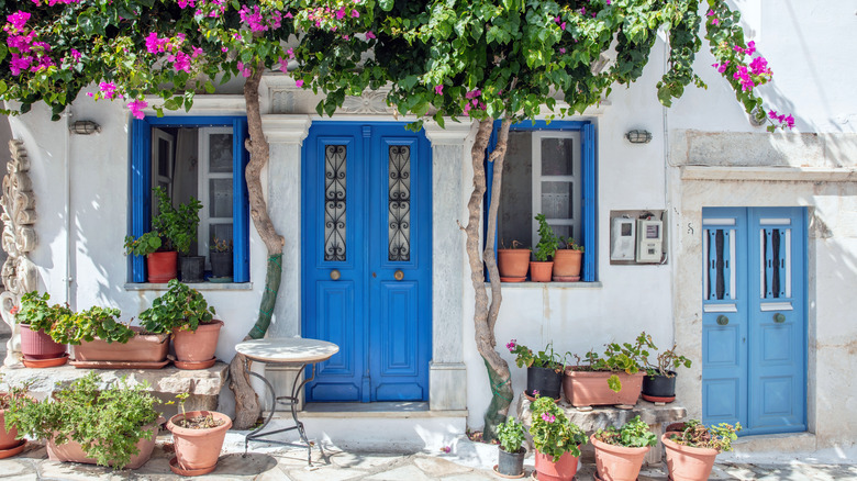 whitewashed Greek house blue door