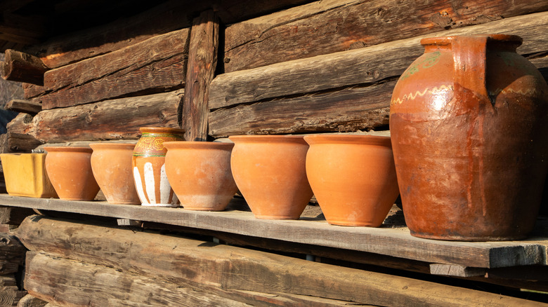 clay pots on shelf