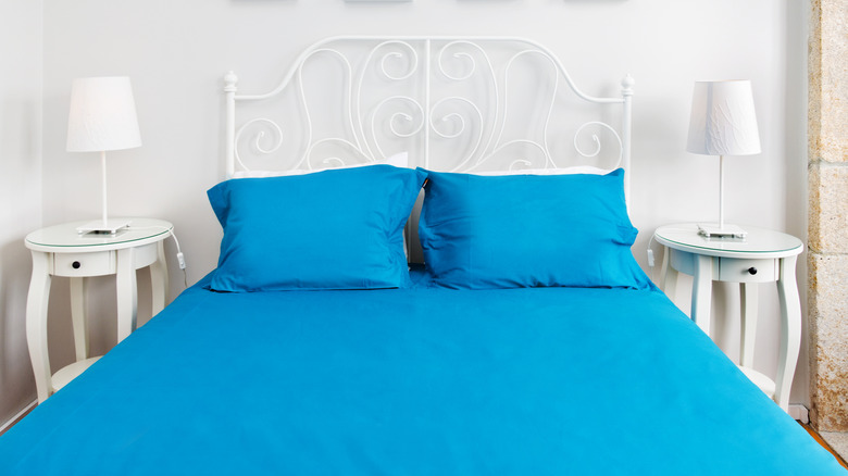 Bed with bright blue sheets