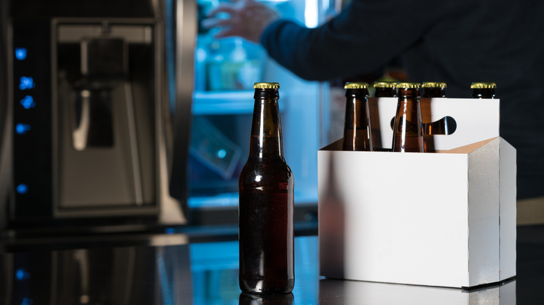 Six-pack of bottled drinks on counter