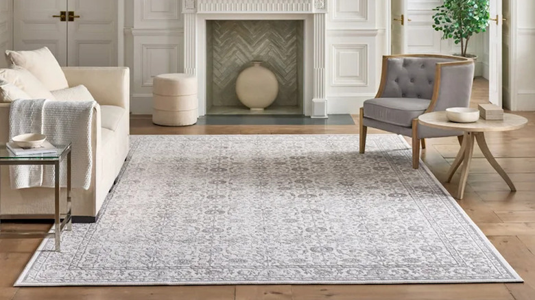 A view of a large area rug with a light-colored design.