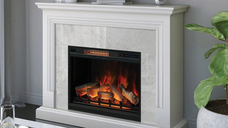 A lit electric fireplace in a home setting.