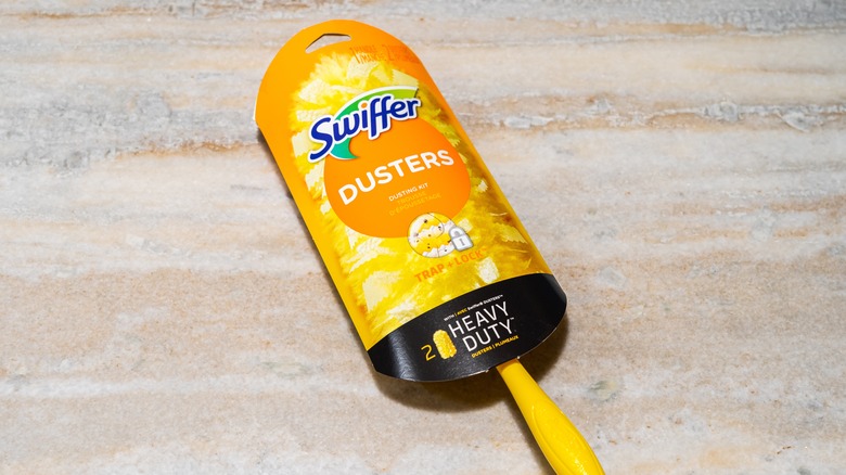 Swiffer duster in packaging on tile