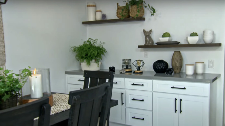 A gray modern dining space with a credenza.
