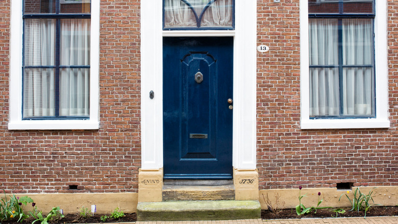 Navy blue door brick house