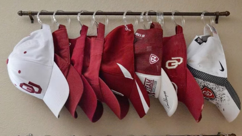 Hats on shower rings hung on curtain rod