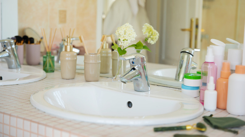 A cluttered bathroom counter