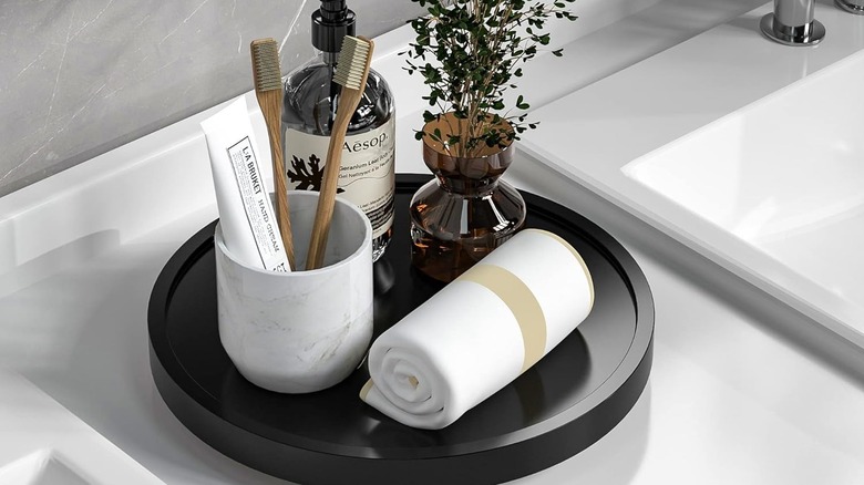 A black bathroom countertop lazy Susan