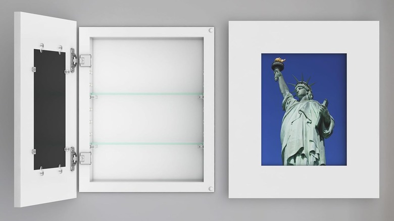 A recessed picture frame medicine cabinet