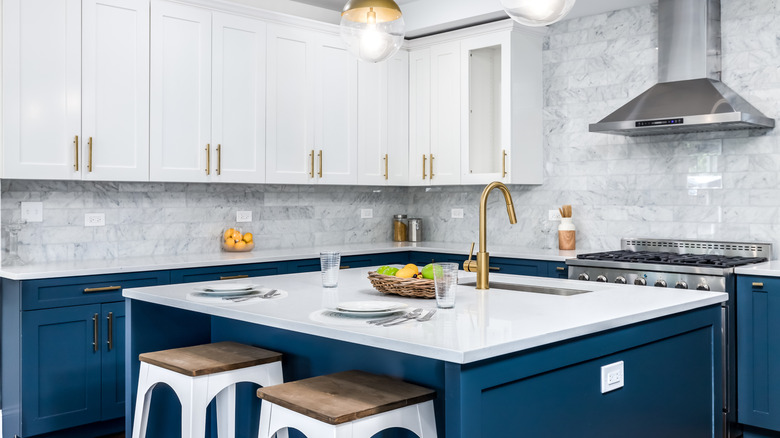 Two-toned kitchen cabinets with navy on the bottom and white on the top