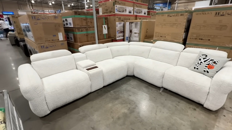 Wireless cleaning scrubber for sale on shelves of Costco