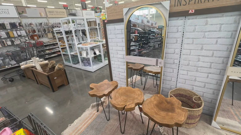 H.E.B. store home decor offerings including curtains, towels, and wooden side tables