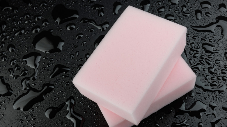 Magic sponges on a wet black background