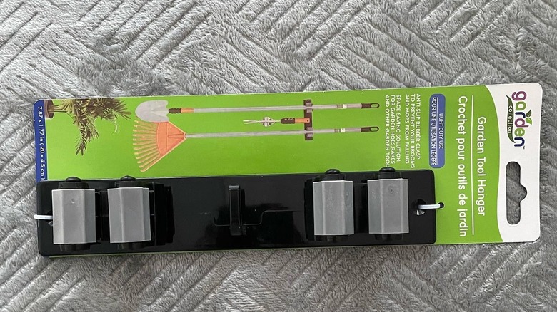 A packaged garden tool hanger