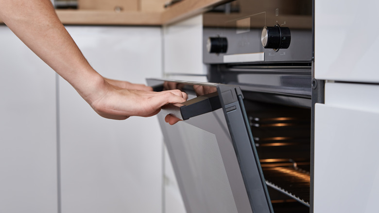 person opening oven