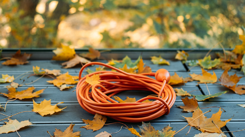 Orange extension cord on the ground