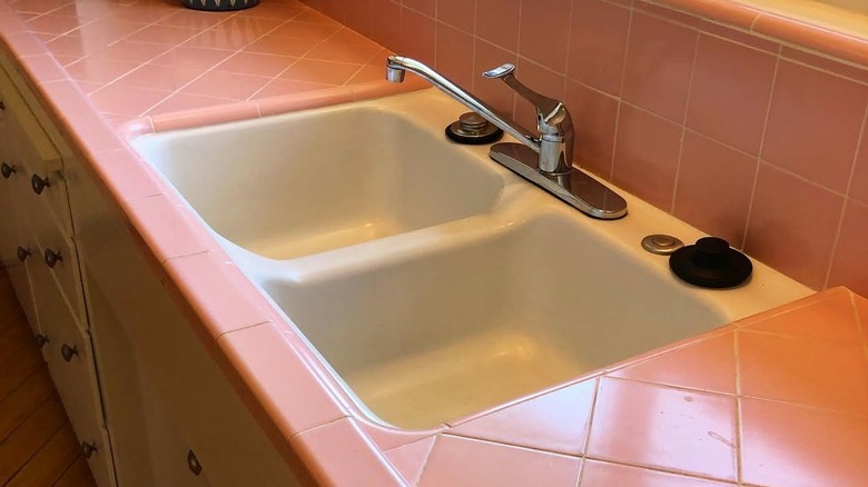 Kitchen with pink tile countertops