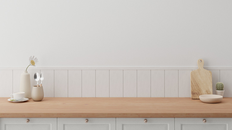 Modern chic wood top countertop with white cabinets