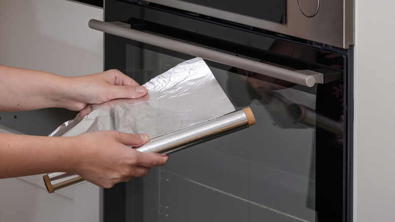 aluminum foil with oven in background