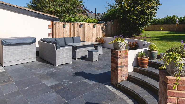 A patio area at the base of a retaining wall
