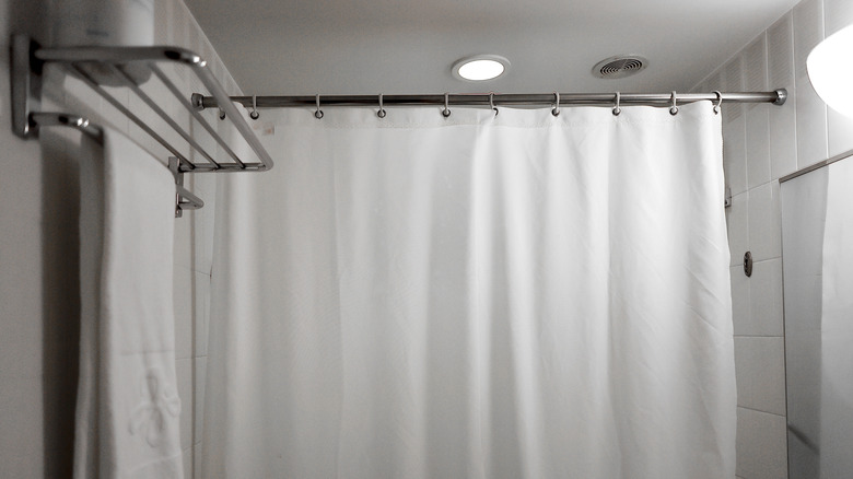 Close up of white shower curtain