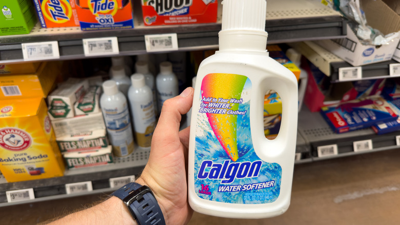 hand holding water conditioner