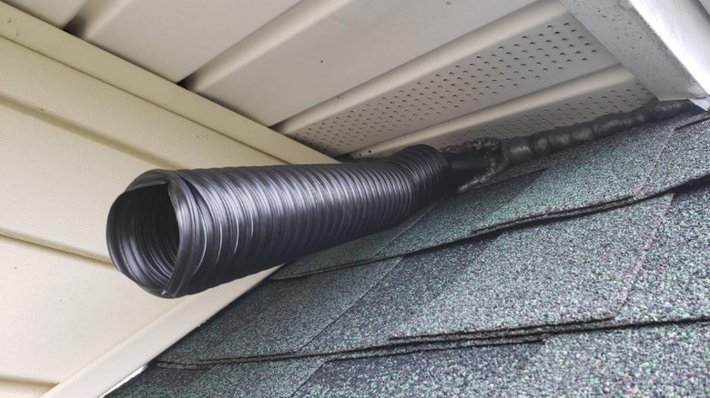 A bat valve is shown protruding from under a home's eave