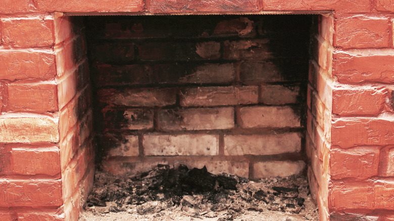 Sooty and dirty brick fireplace